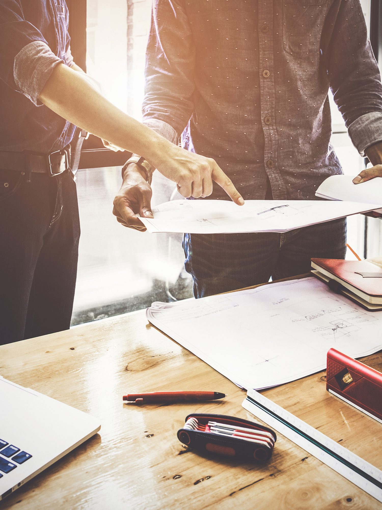 Two Architect man working with compasses and blueprints for architectural plan,engineer sketching a construction project concept.